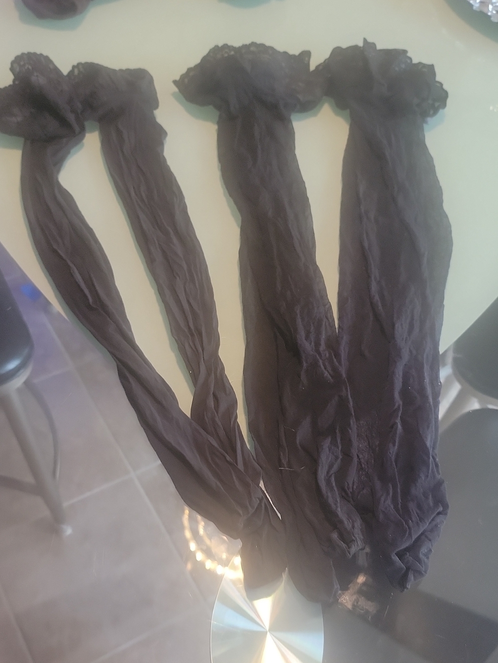 sheer Black thigh-high stockings featuring delicate lace trim. 3 Pair Lot
